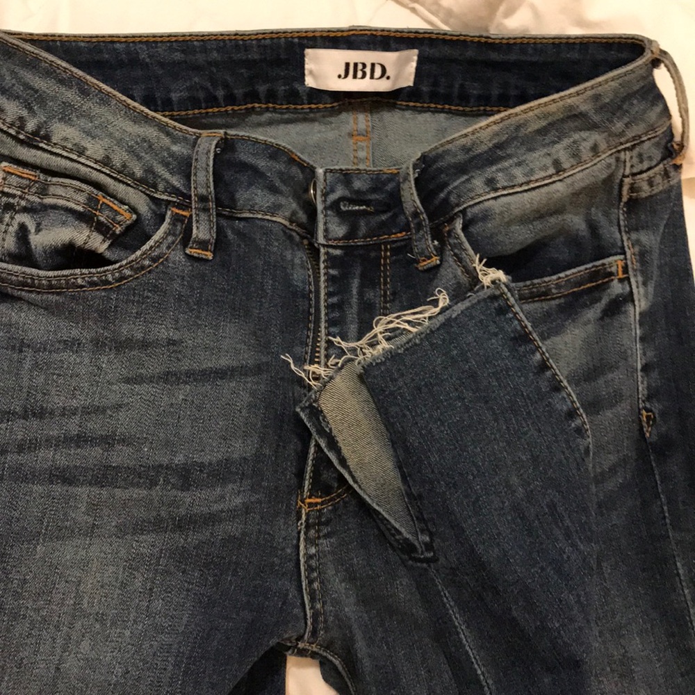 Just black denim jeans with ankle slit